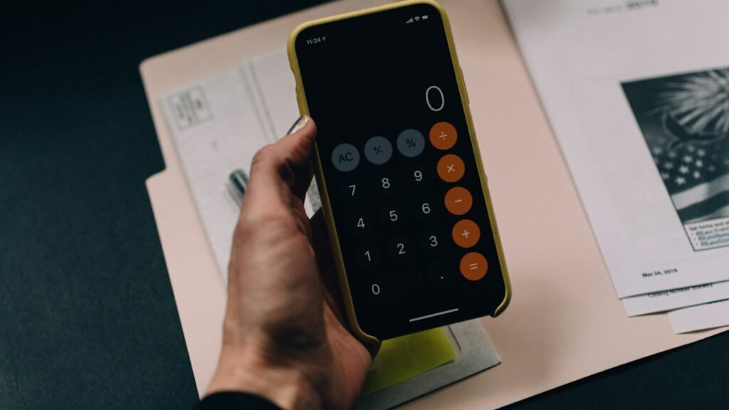 Calculator and financial paperwork representing personal budgeting and money management